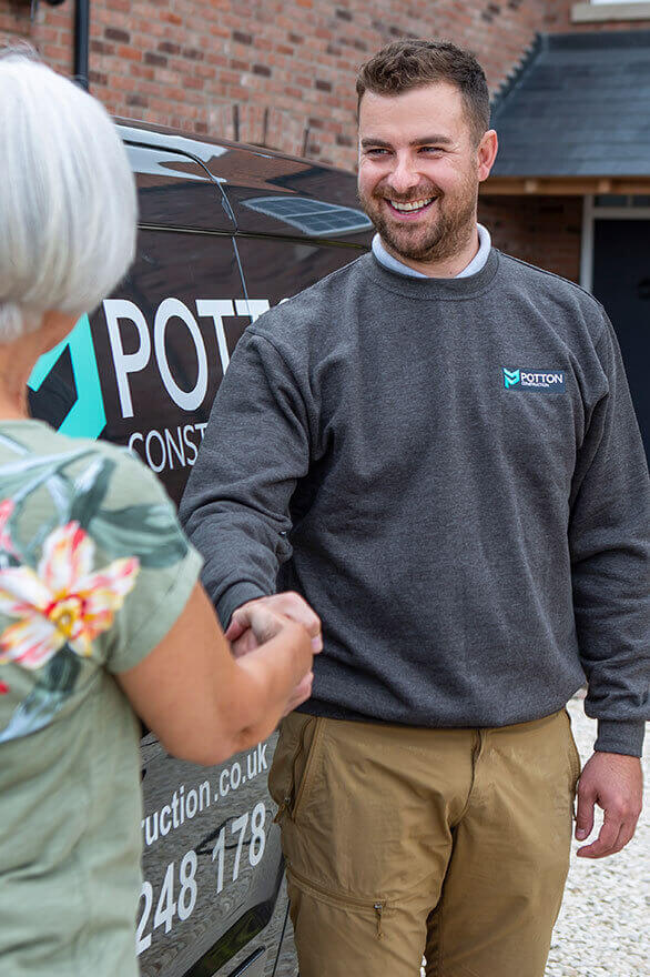 Brendan Potton shaking hands with a client